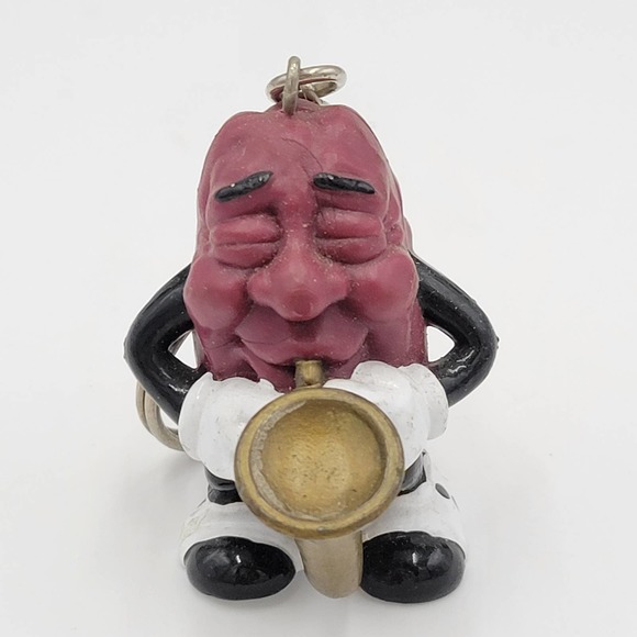 California 1987 Vintage Raisin Saxophone Player Keychain - Picture 1 of 5
